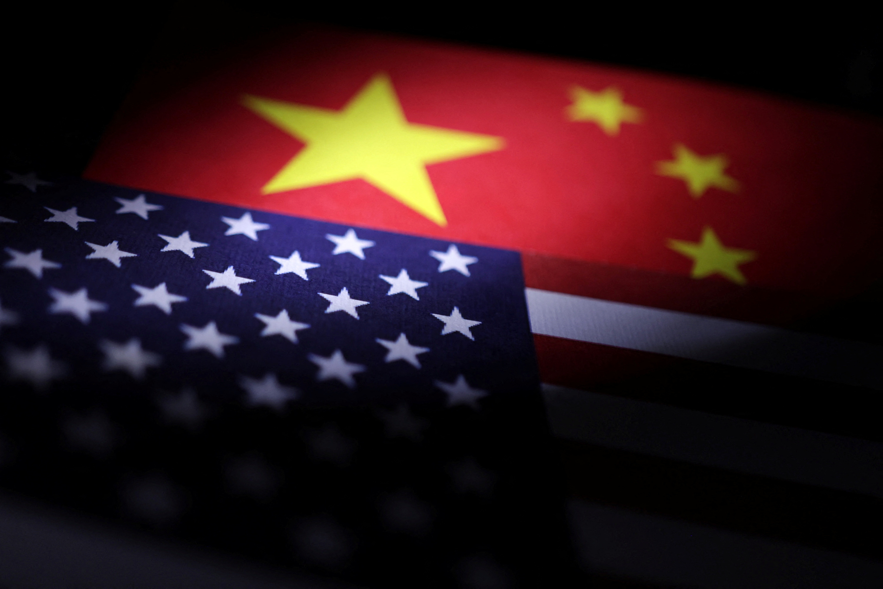 Illustration shows U.S. and Chinese flags