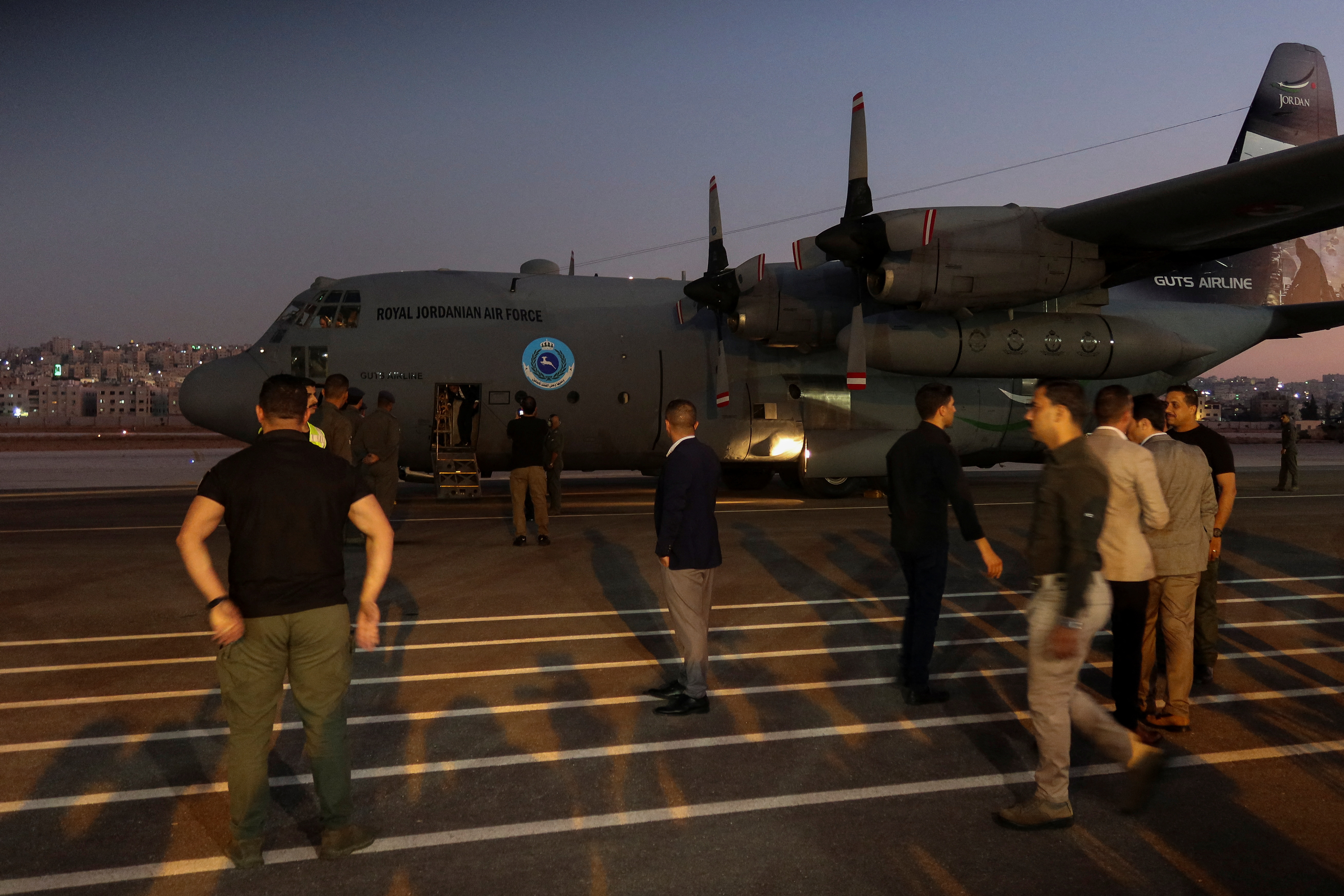 An aircraft carrying Jordanian evacuees from Lebanon lands at Marka military airport, in Amman