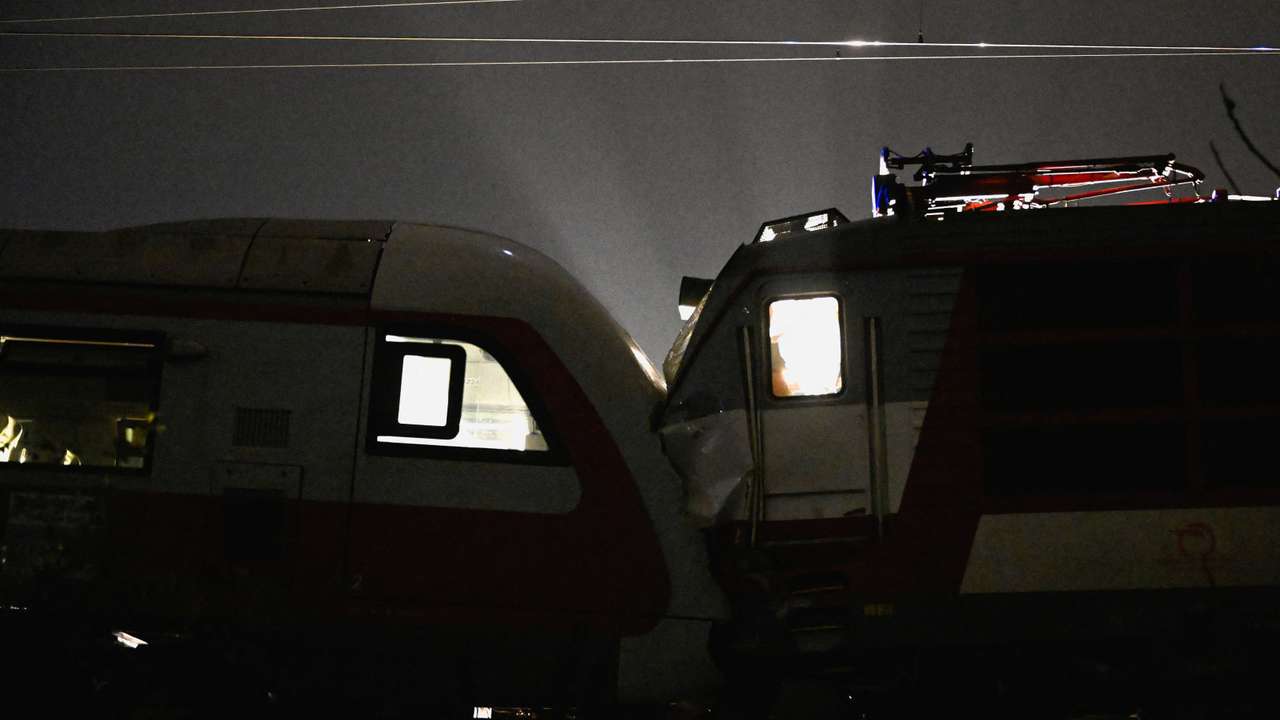 First responders attend the scene of a collision between two trains in the town of Pezinok