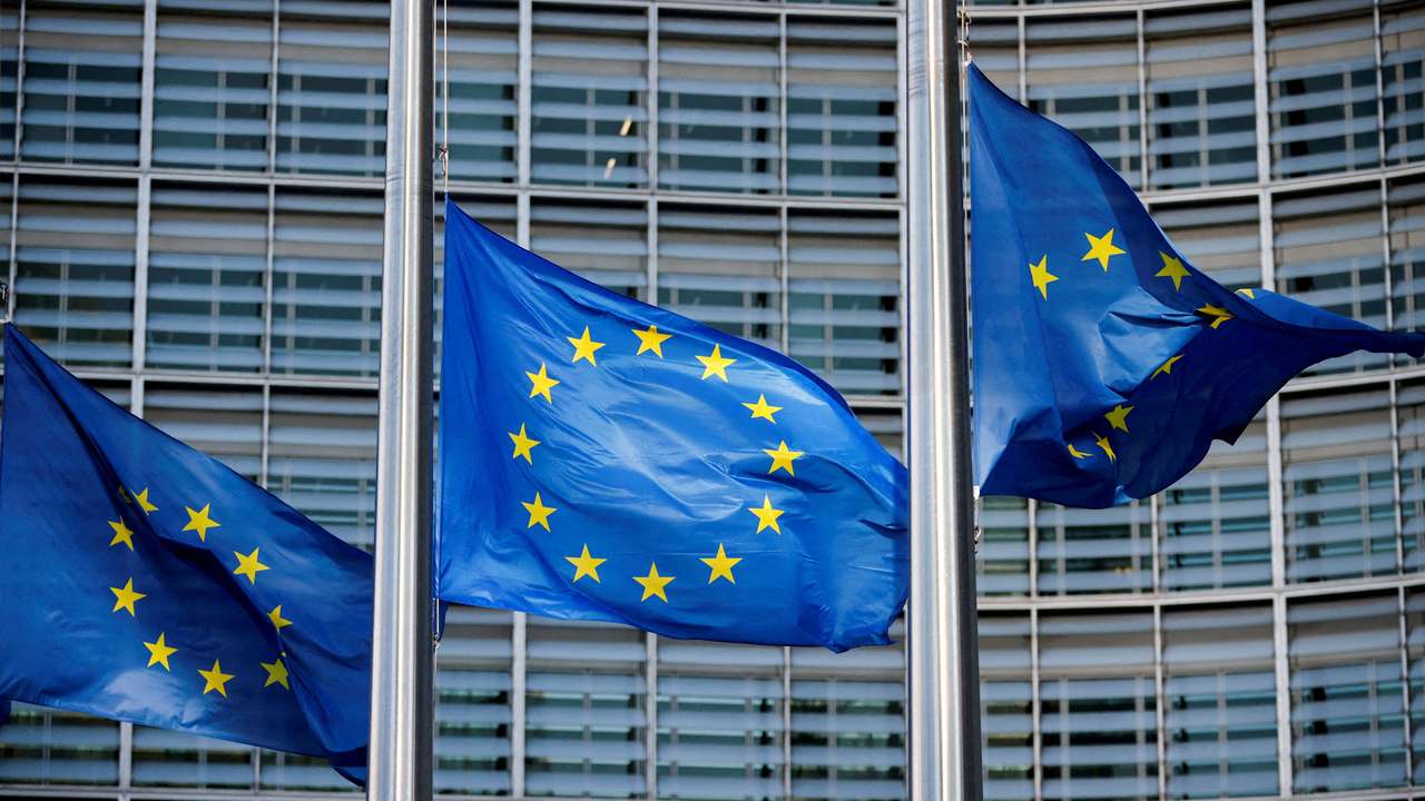 FILE PHOTO: European Union flags fly outside the European Commission headquarters in Brussels