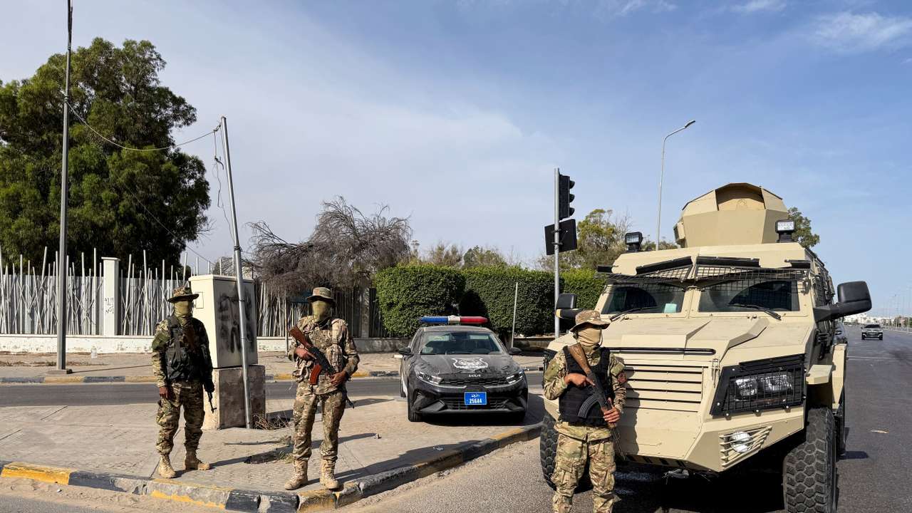 Members of the 444 Brigade of the Libyan Army stand guard at Abu Salim area in Tripoli