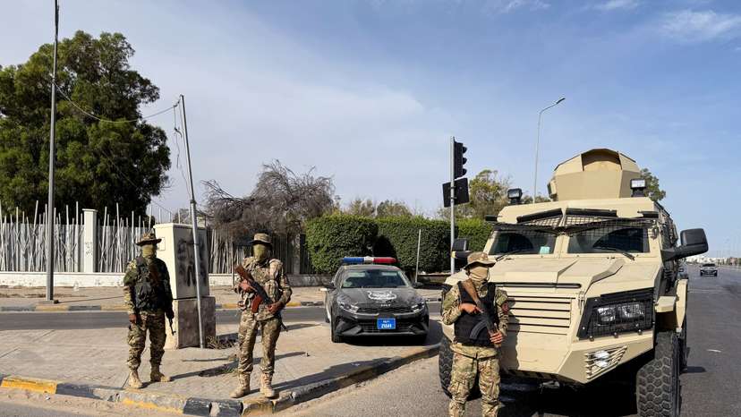 Members of the 444 Brigade of the Libyan Army stand guard at Abu Salim area in Tripoli