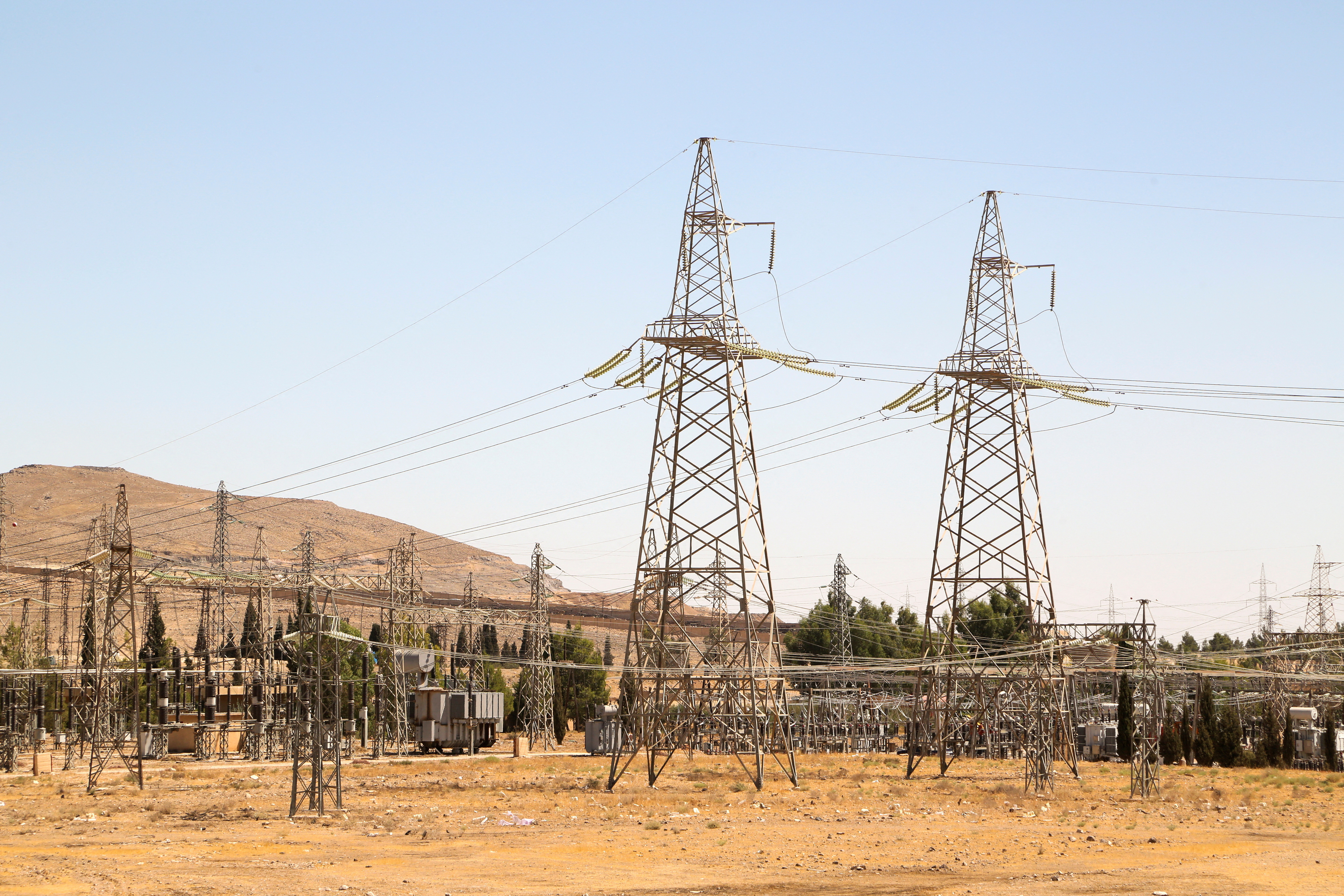 FILE PHOTO: A view shows electricity pylons in Kiswah, Damascus suburbs