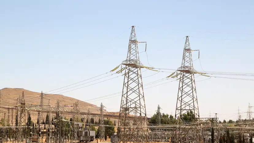 FILE PHOTO: A view shows electricity pylons in Kiswah, Damascus suburbs