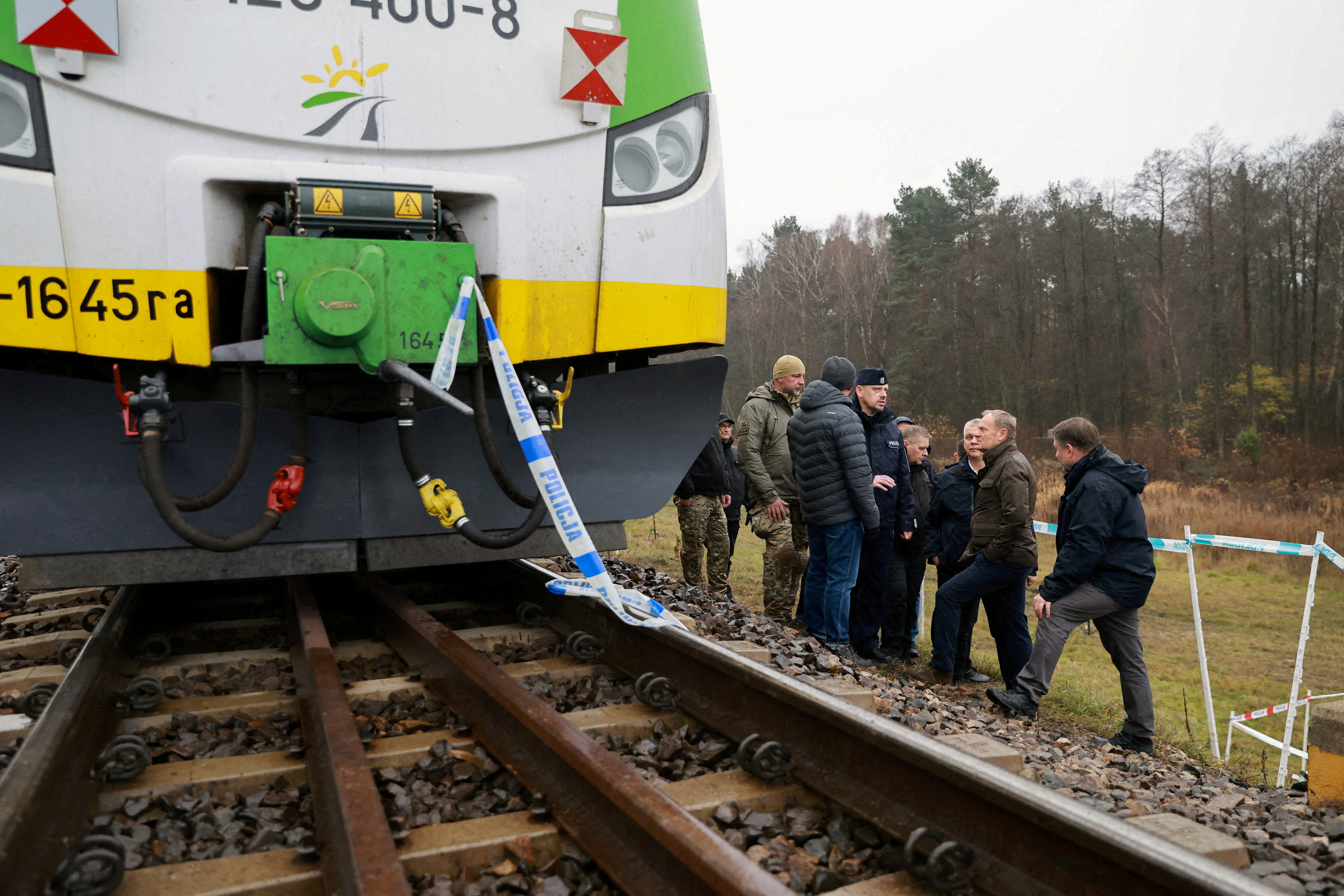 FILE PHOTO: Polish PM Tusk visits blast site on railways of Warsaw-Lublin line in Mika