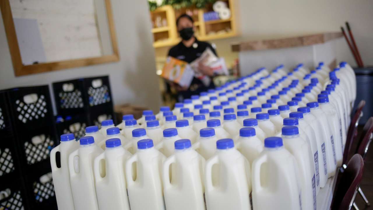 Plastic containers with milk are seen inside the El Elyon church which gives temporary shelter to asylum-seeker migrants, in El Paso