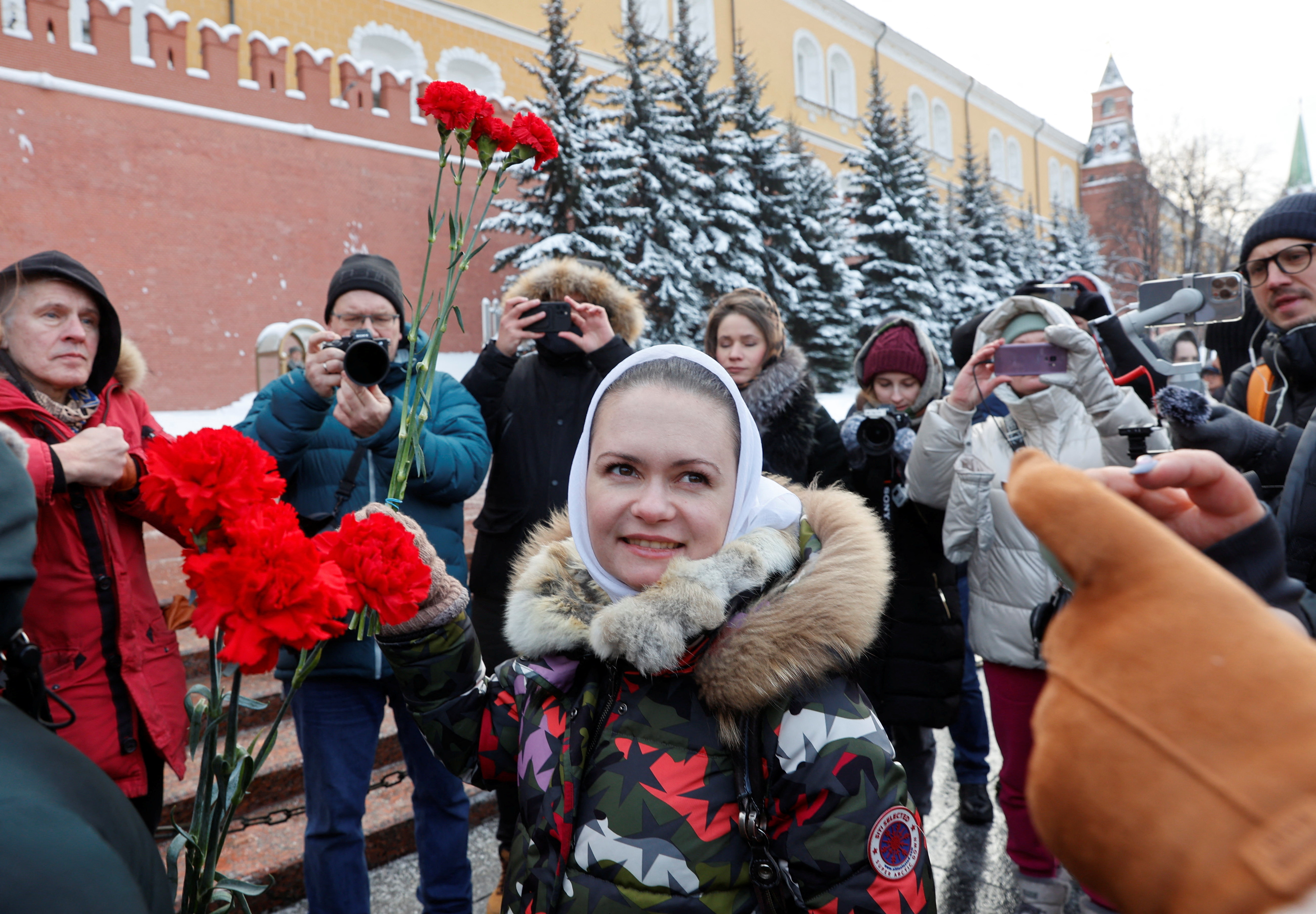 Wives of Russian mobilised servicemen lay flowers at the Tomb of the Unknown Soldier in Moscow