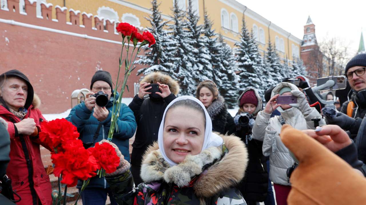 Wives of Russian mobilised servicemen lay flowers at the Tomb of the Unknown Soldier in Moscow
