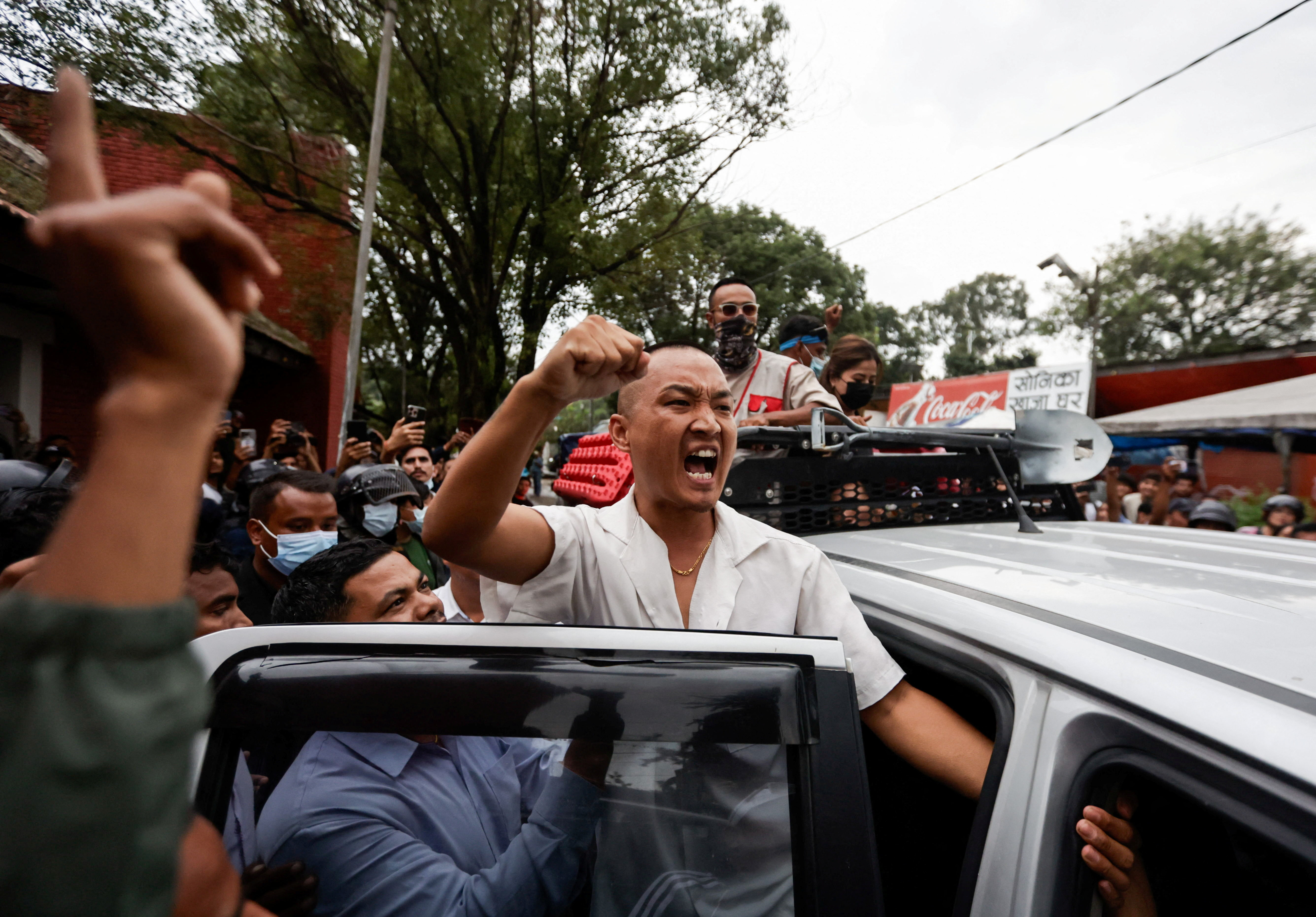 Sudan Gurung, 36, founder of Hami Nepal, shouts as he returns after a brawl during their press conference, following last week's deadly anti-corruption protests, in Kathmandu