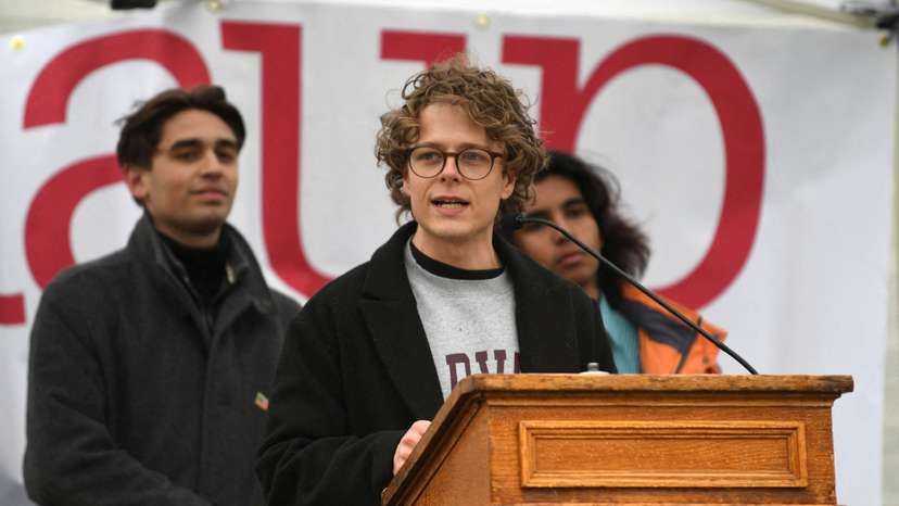 FILE PHOTO: Demonstrators rally on Cambridge Common in a protest organized by the City of Cambridge against interference by the federal government, in Cambridge
