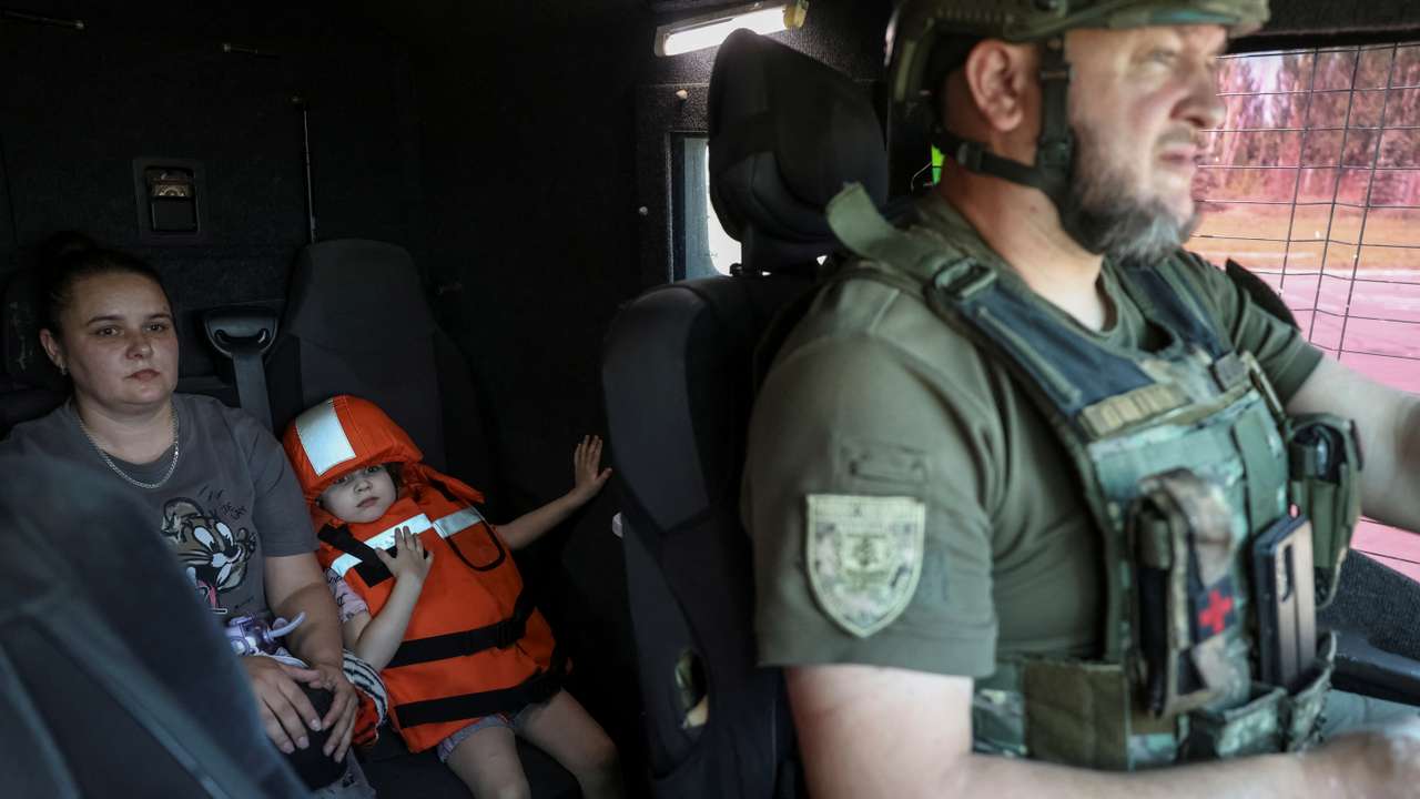 BEWSResidents sit in an armoured vehicle as police evacuate them from the frontline town of Kostyantynivka