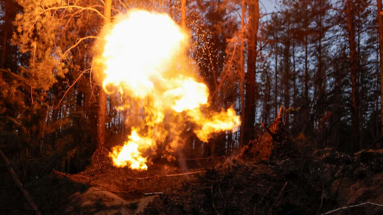 Ukrainian service members fire a mortar towards Russian troops, at a position in a front line in Donetsk region