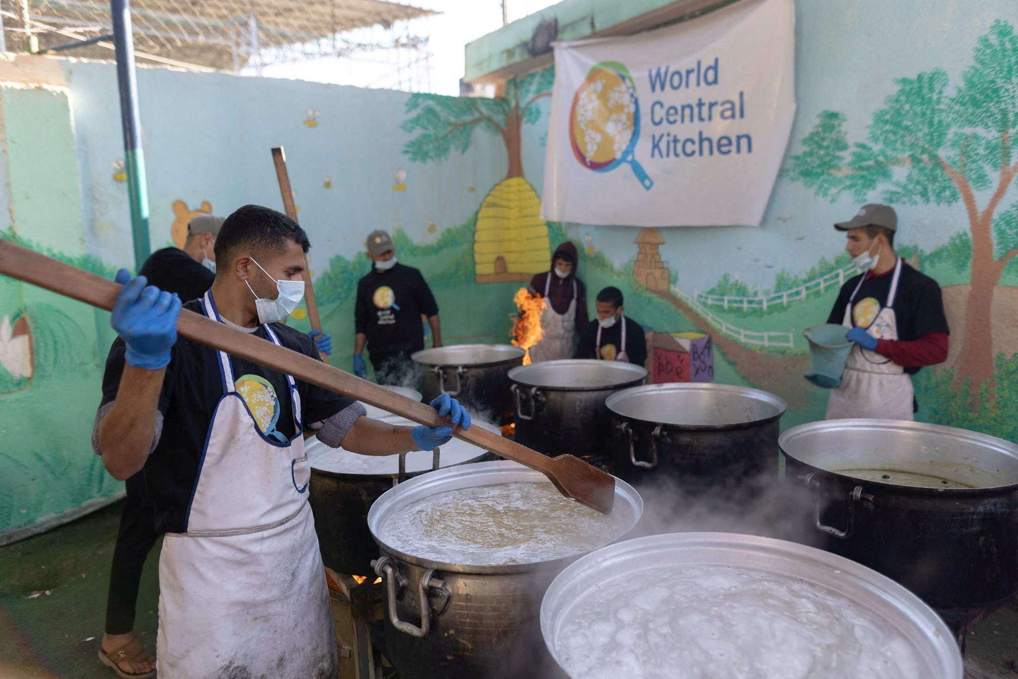 FILE PHOTO: Members of "World Central Kitchen" prepare food for Palestinians, in the location given as Gaza
