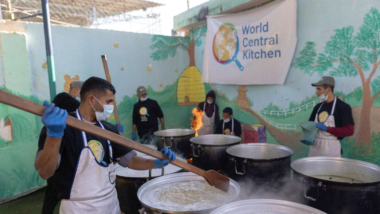 FILE PHOTO: Members of "World Central Kitchen" prepare food for Palestinians, in the location given as Gaza