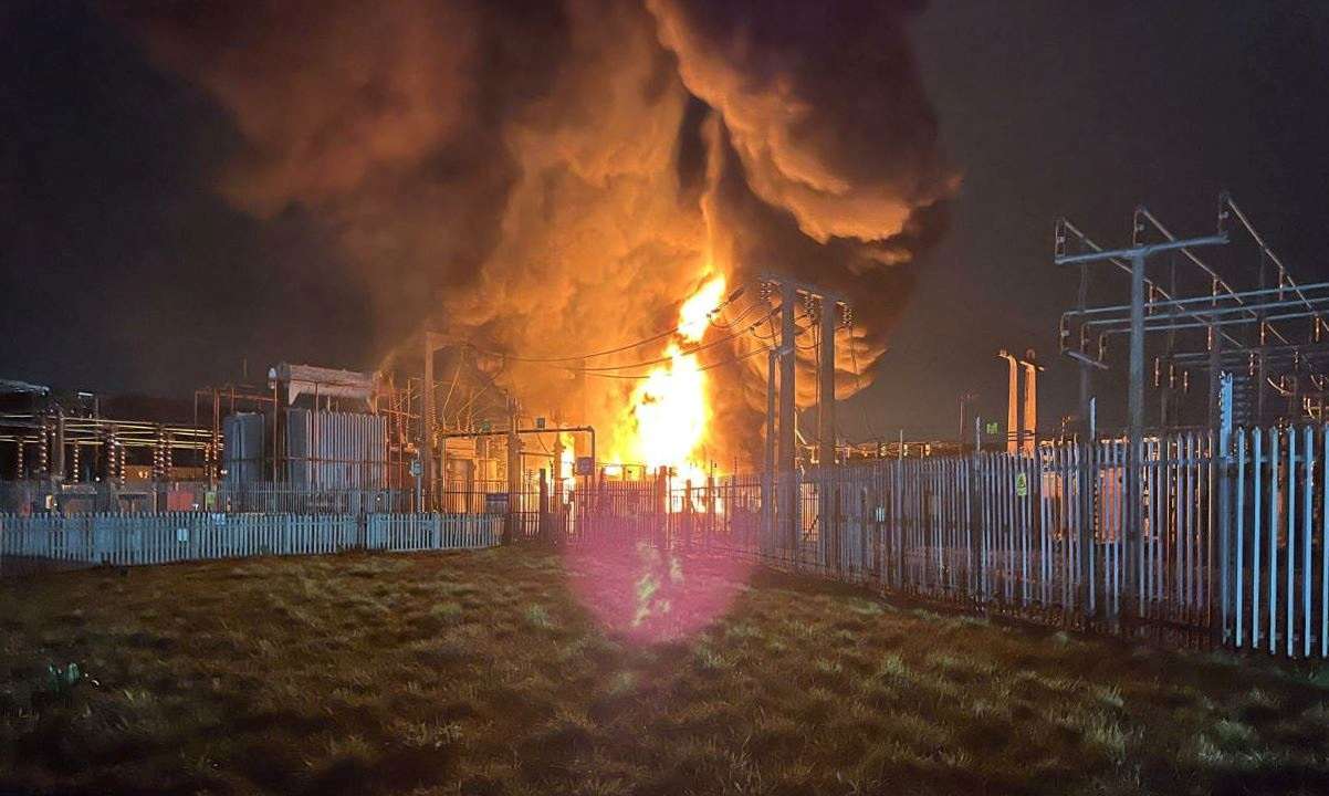 Fire, which wiped out power and closed Heathrow Airport, rises at the North Hyde Electricity Substation in Hayes