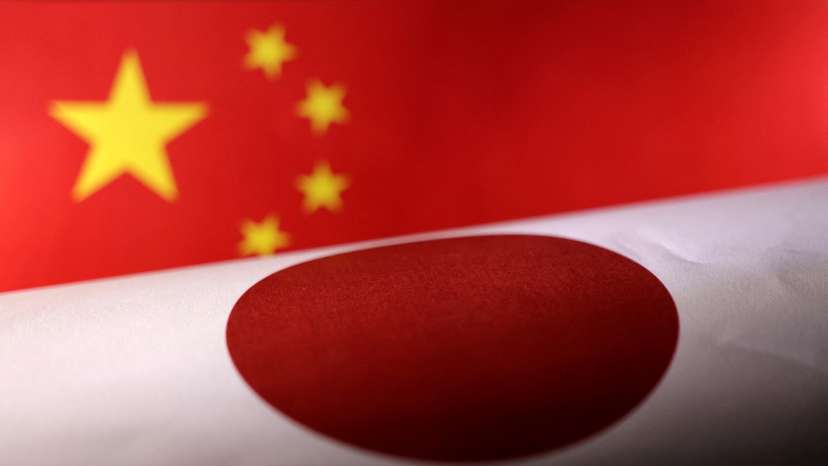 FILE PHOTO: Illustration shows printed Chinese and Japanese flags