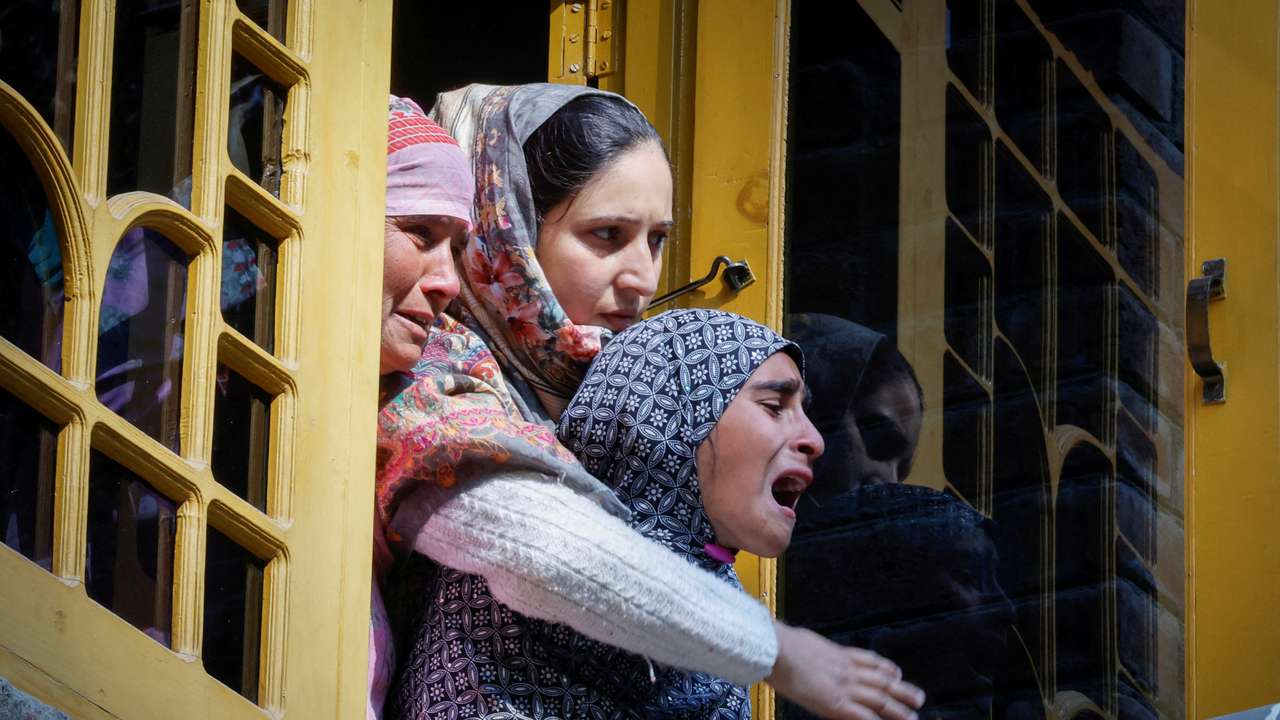Women mourn Shahnawaz Dar, a doctor who was killed in a suspected militant attack at a tunnel construction site in Ganderbal's Gaganeer, during his funeral in Budgam