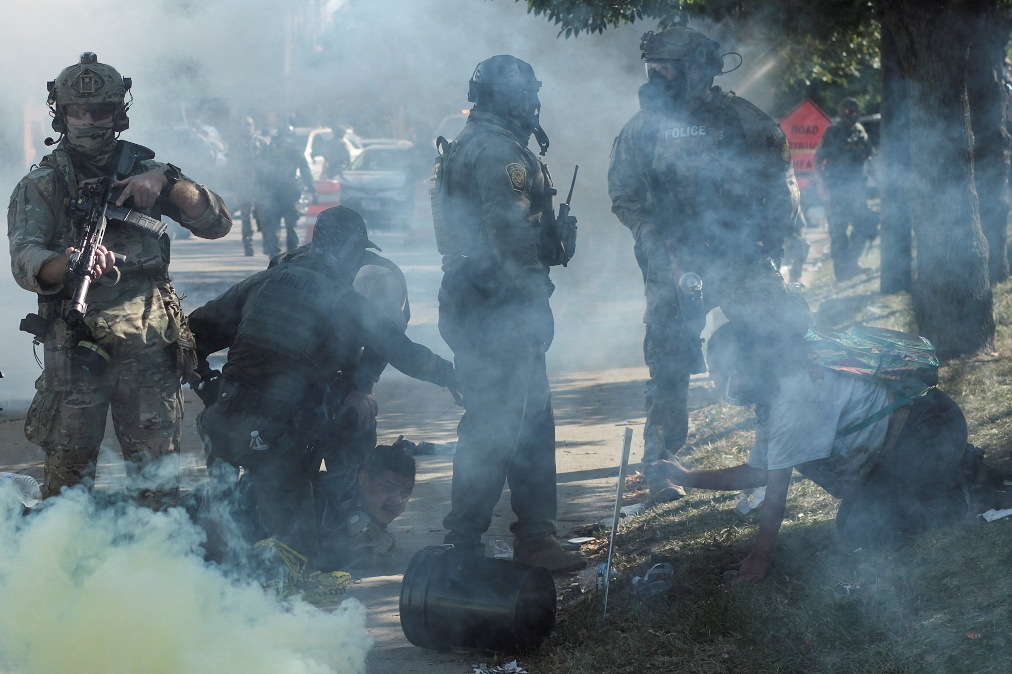 People protest during a standoff with ICE and federal officers in Chicago