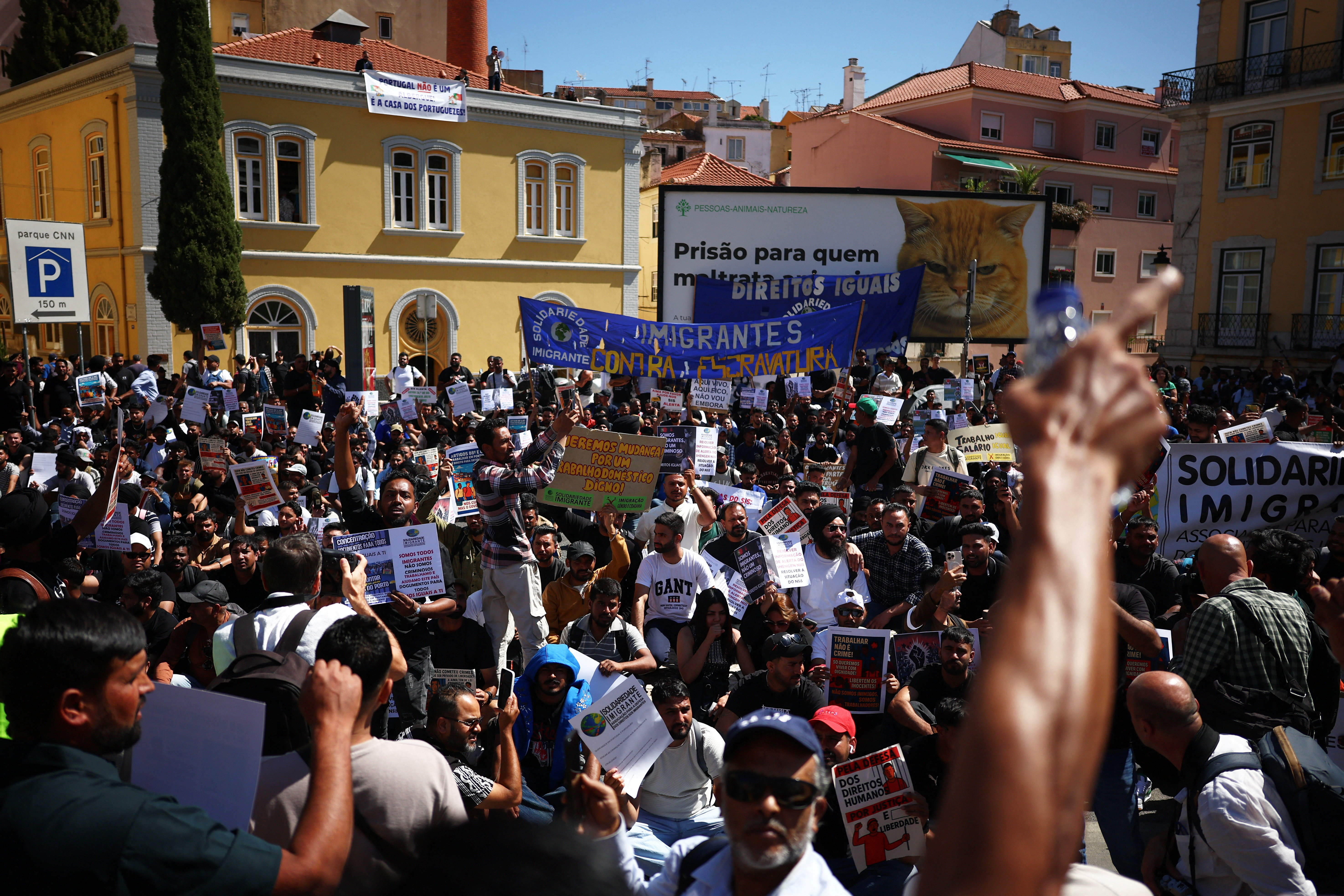 Migrants protest in front of the Portuguese parliament for rights and residency permits, in Lisbon