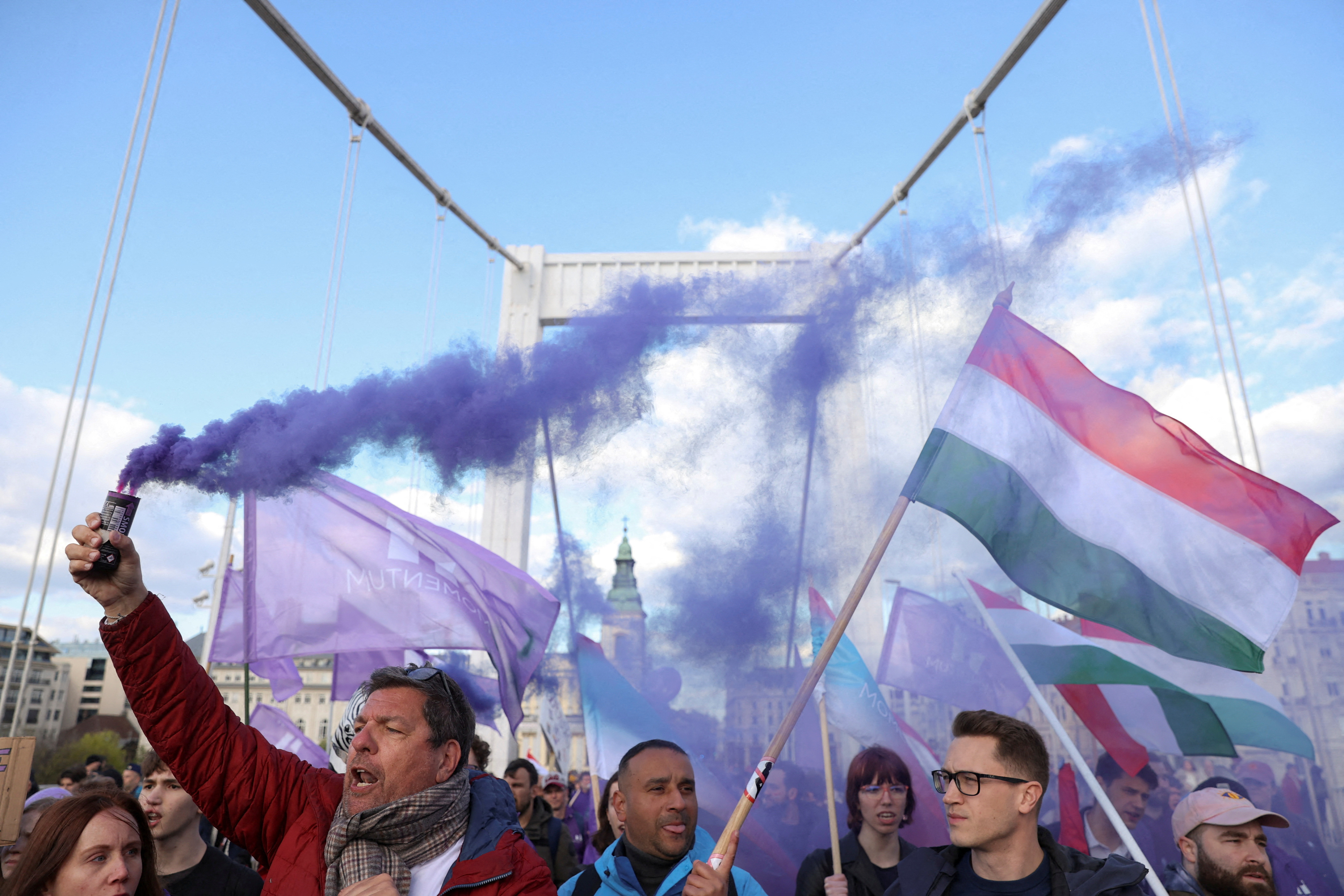 FILE PHOTO: People demonstrate after Hungarian parliament passed a law that will ban LGBTQ+ communities from holding their annual Pride march, in Budapest