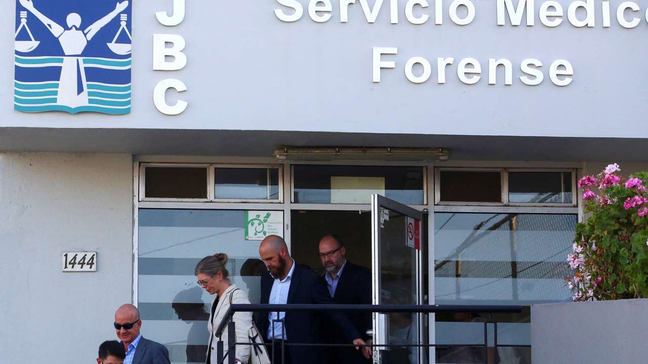 Members of the United States and Australian embassies and the parents of missing U.S. and Australian tourists leave the Forensic Medical Service in Ensenada