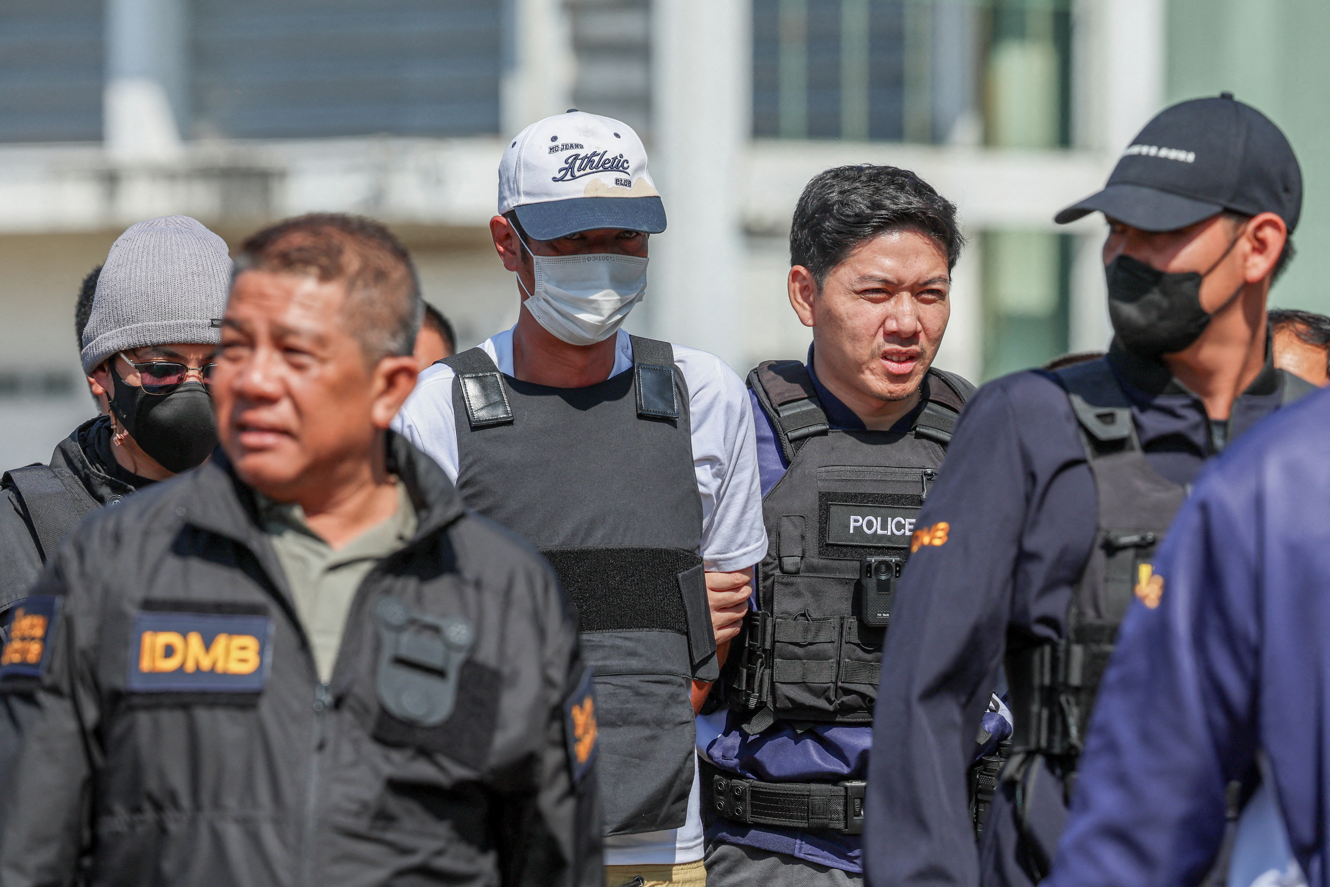 Ekkalak Paenoi, a suspect in the assassination of a former politician with now-dissolved Cambodia National Rescue Party (CNRP) Lim Kimya, 74, arrives in Thailand