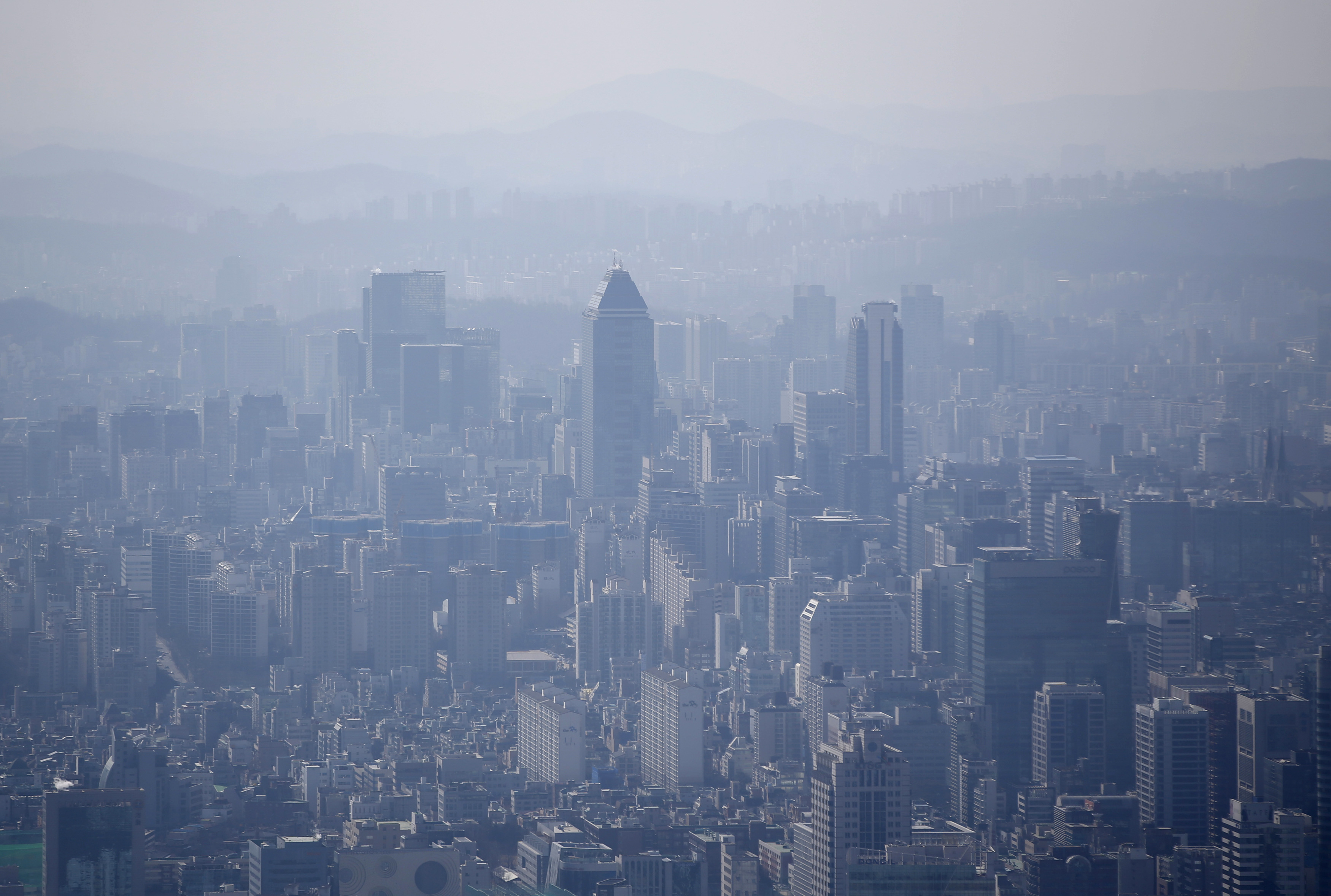 The skyline of central Seoul is seen during a foggy day in Seoul