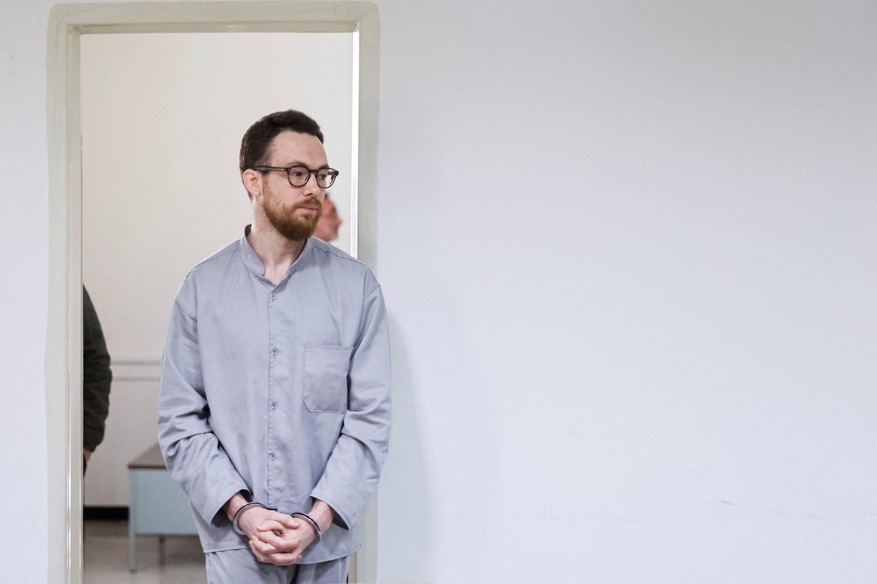 Swedish EU employee Johan Floderus attends a court session in Tehran