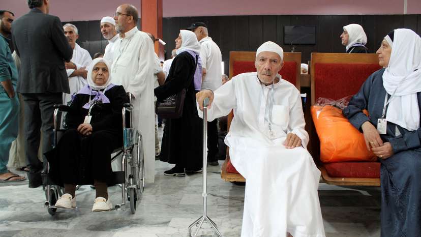Syrian pilgrims wait to board a flight to Saudi Arabia at Damascus airport