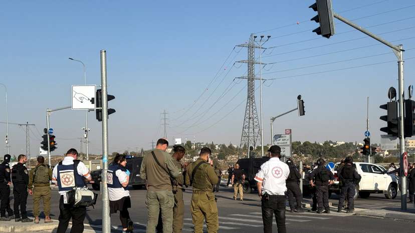 Israeli forces and emergency responders work at the scene of what Israel's ambulance services said was a fatal stabbing attack at the Gush Etzion junction in the Israeli-occupied West Bank