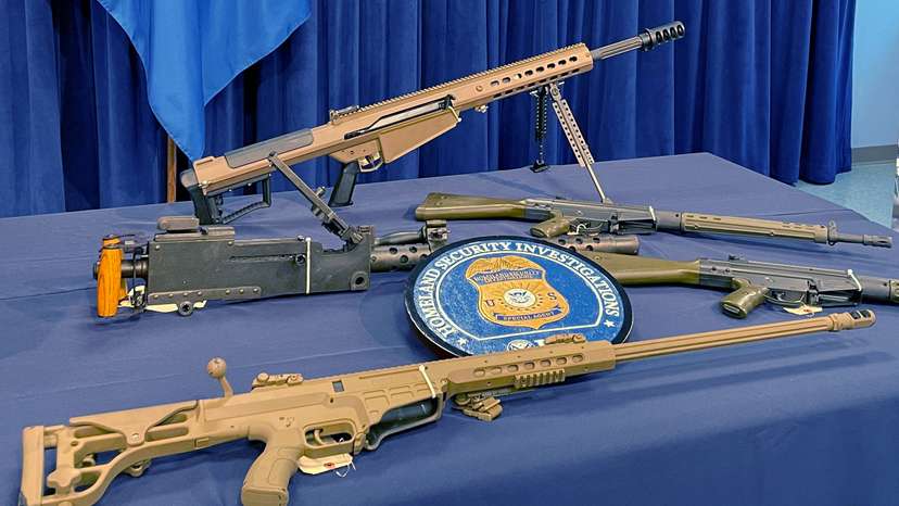Seized weapons are displayed during a news conference in Miami