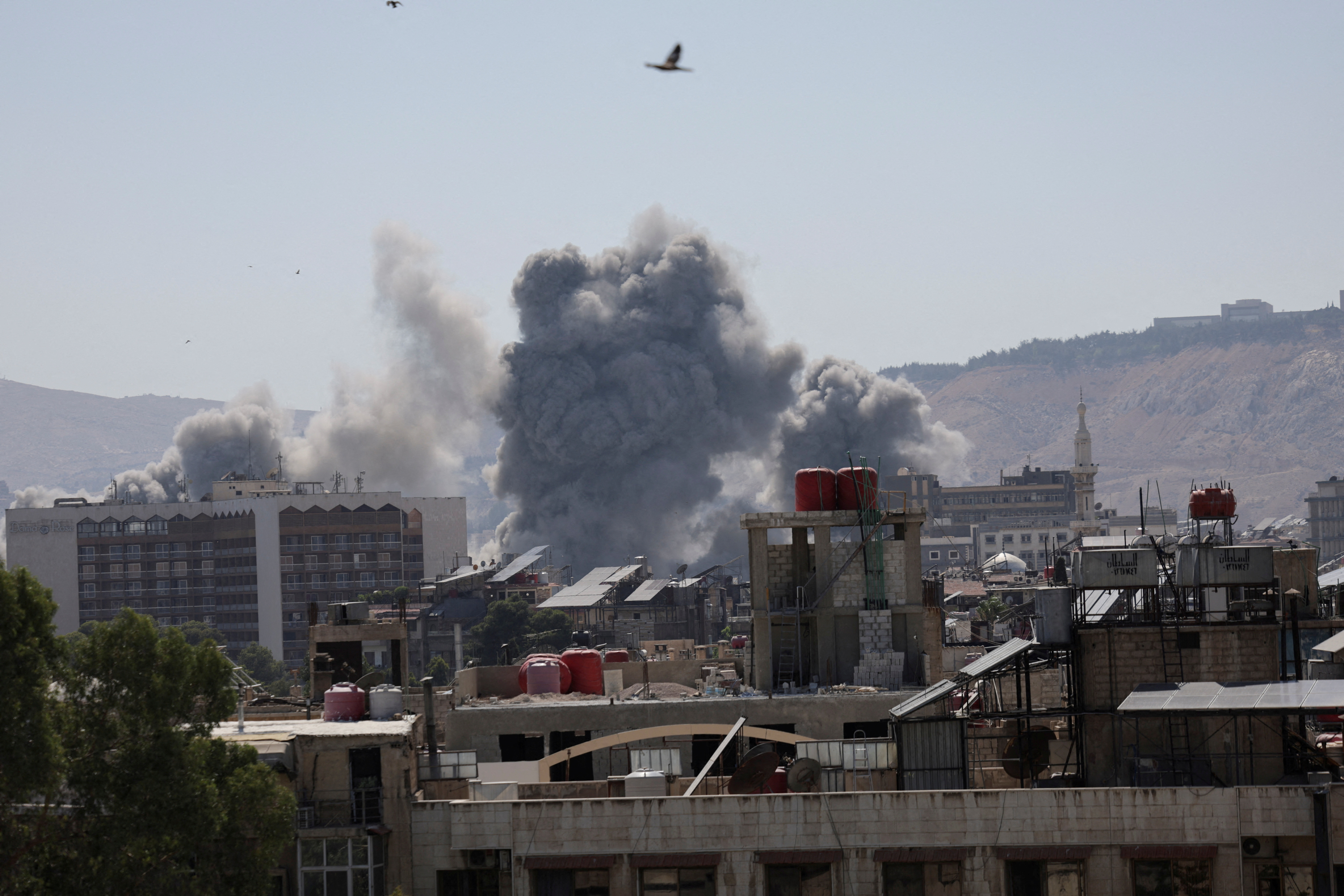 Smoke rises after strikes on Syria's defense ministry in Damascus