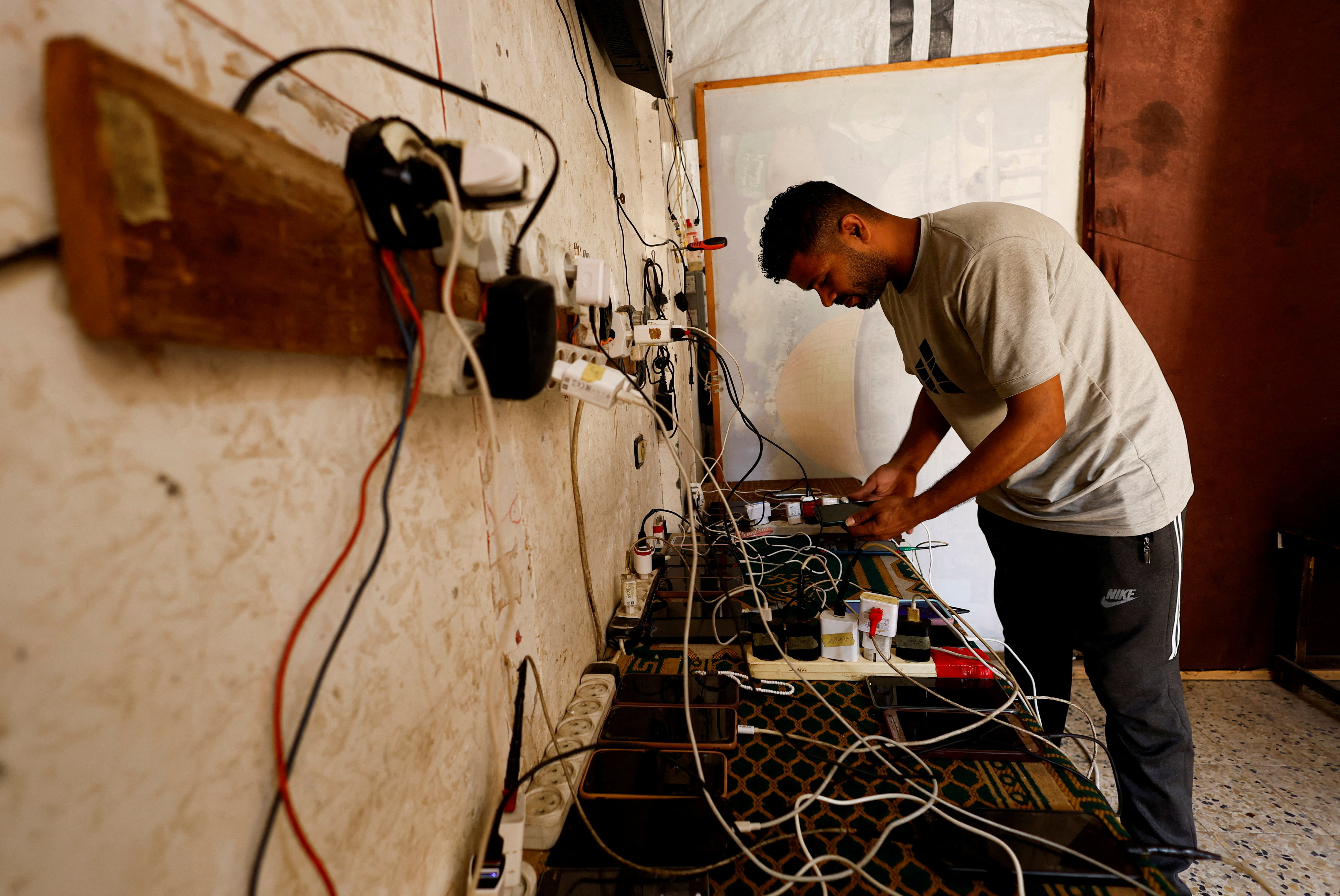 Gazans live in the dark post-sunset as power grid lies in ruins in Nuseirat