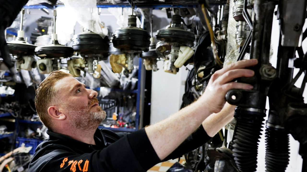 A Syrian, Ahmed al-Akhras, works at his car spare parts shop, in Cairo