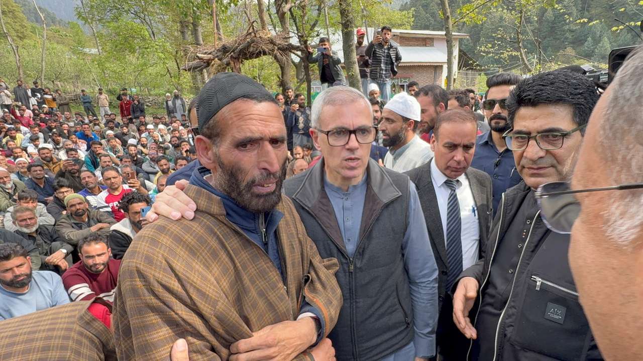 Omar Abdullah, Chief Minister of Jammu and Kashmir, consoles the father of Adil Hussain Shah who was killed in a suspected militant attack near Pahalgam, before the funeral prayers in Hapatnard
