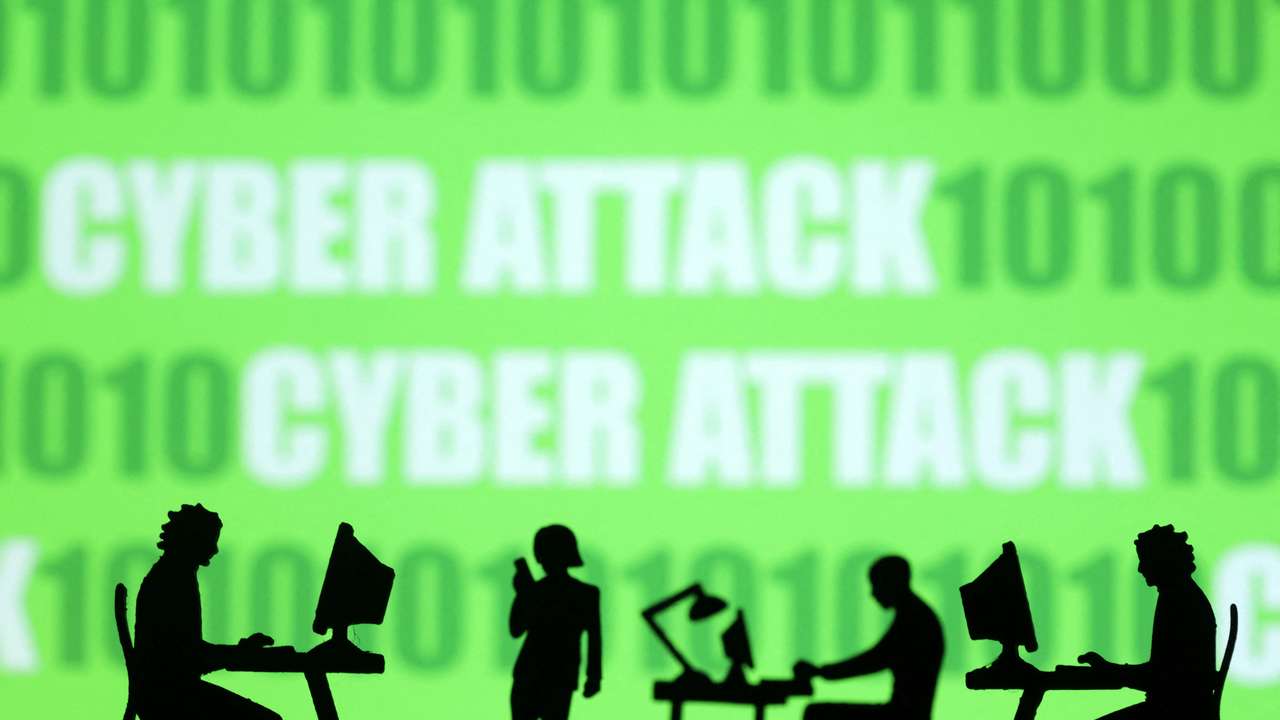 Illustration shows miniatures of people with computers, binary codes and words 'Cyber attack'