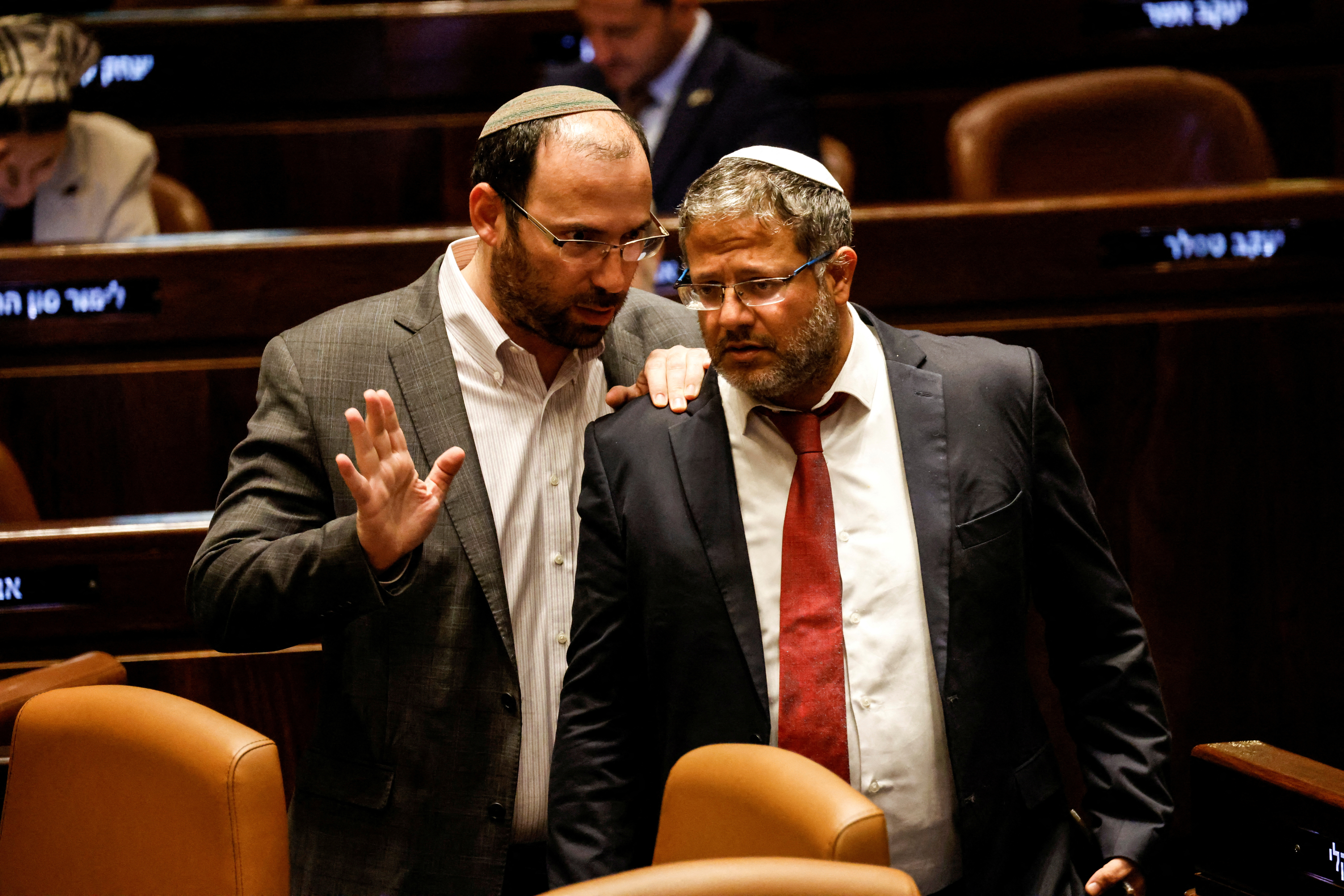 FILE PHOTO: Israeli lawmakers gather at the Knesset plenum to vote on a bill that would limit some Supreme Court power, in Jerusalem