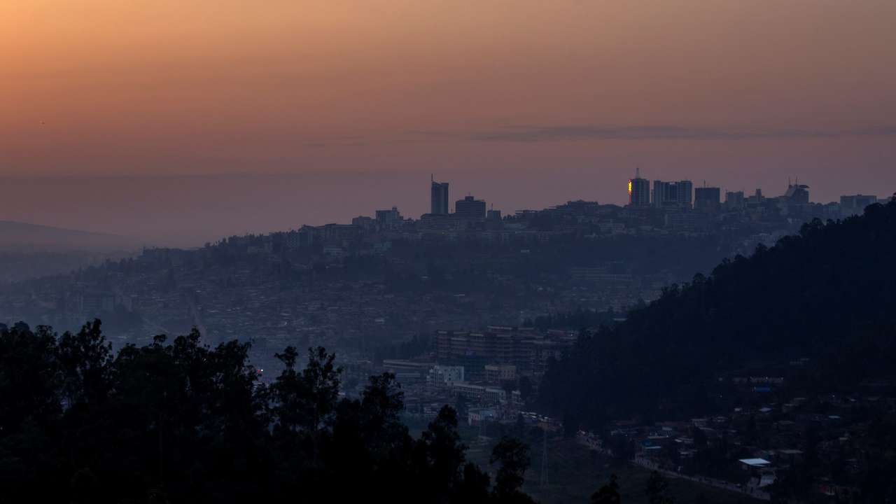 FILE PHOTO: A general view at dawn shows part of the cityscape of Kigali