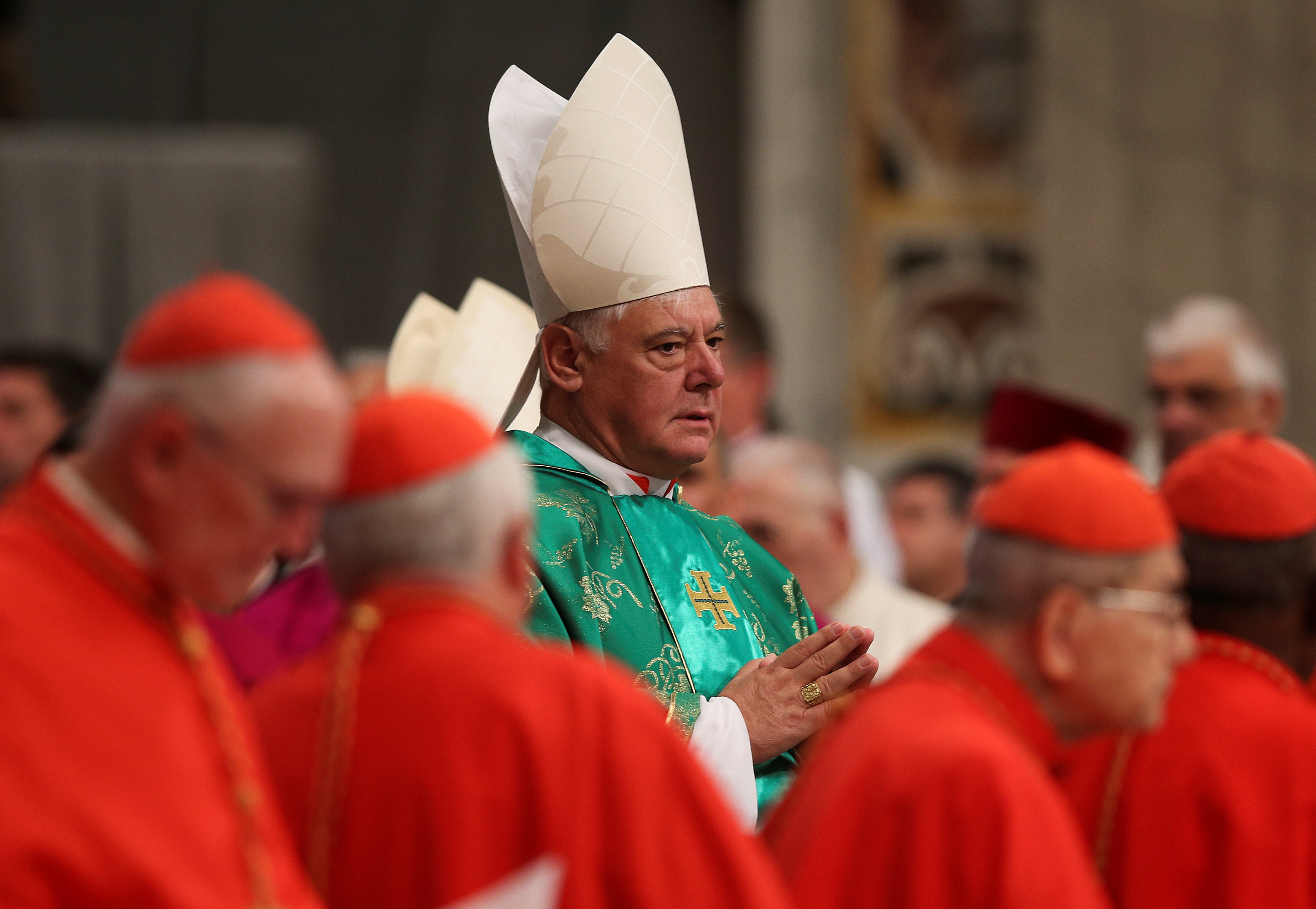 Newly elected cardinal Gerhard Ludwig Muller of Germany arrives during a consistory ceremony led by Pope Francis in Saint Peter's Basilica at the Vatican