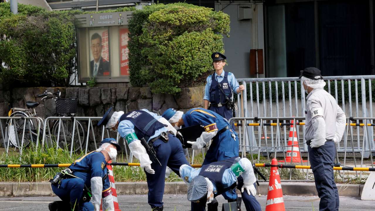 Police investigate an incident at the headquarters of the Liberal Democratic Party, in Tokyo