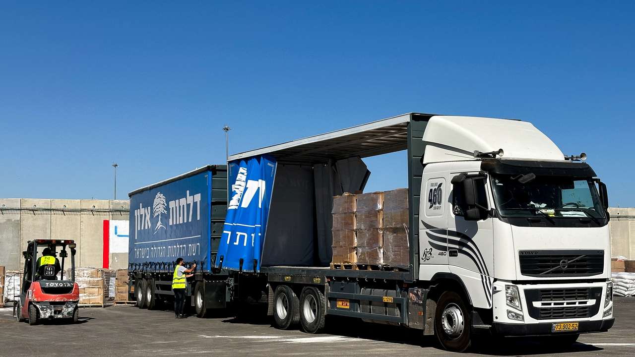A truck carrying aid stands at the Kerem Shalom crossing between Israel and Gaza