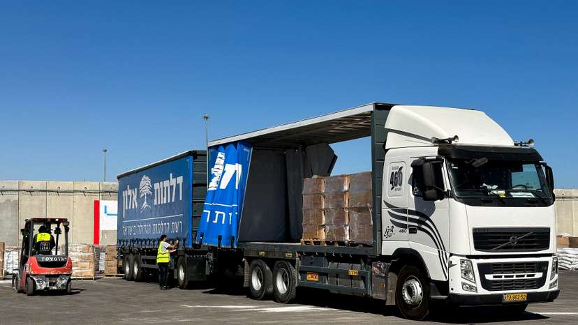 A truck carrying aid stands at the Kerem Shalom crossing between Israel and Gaza