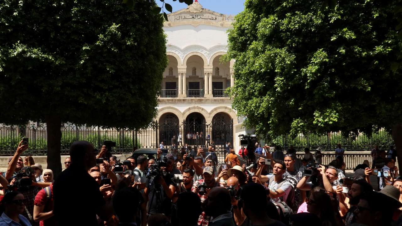 Journalists protest outside the Palace of Justice in Tunis