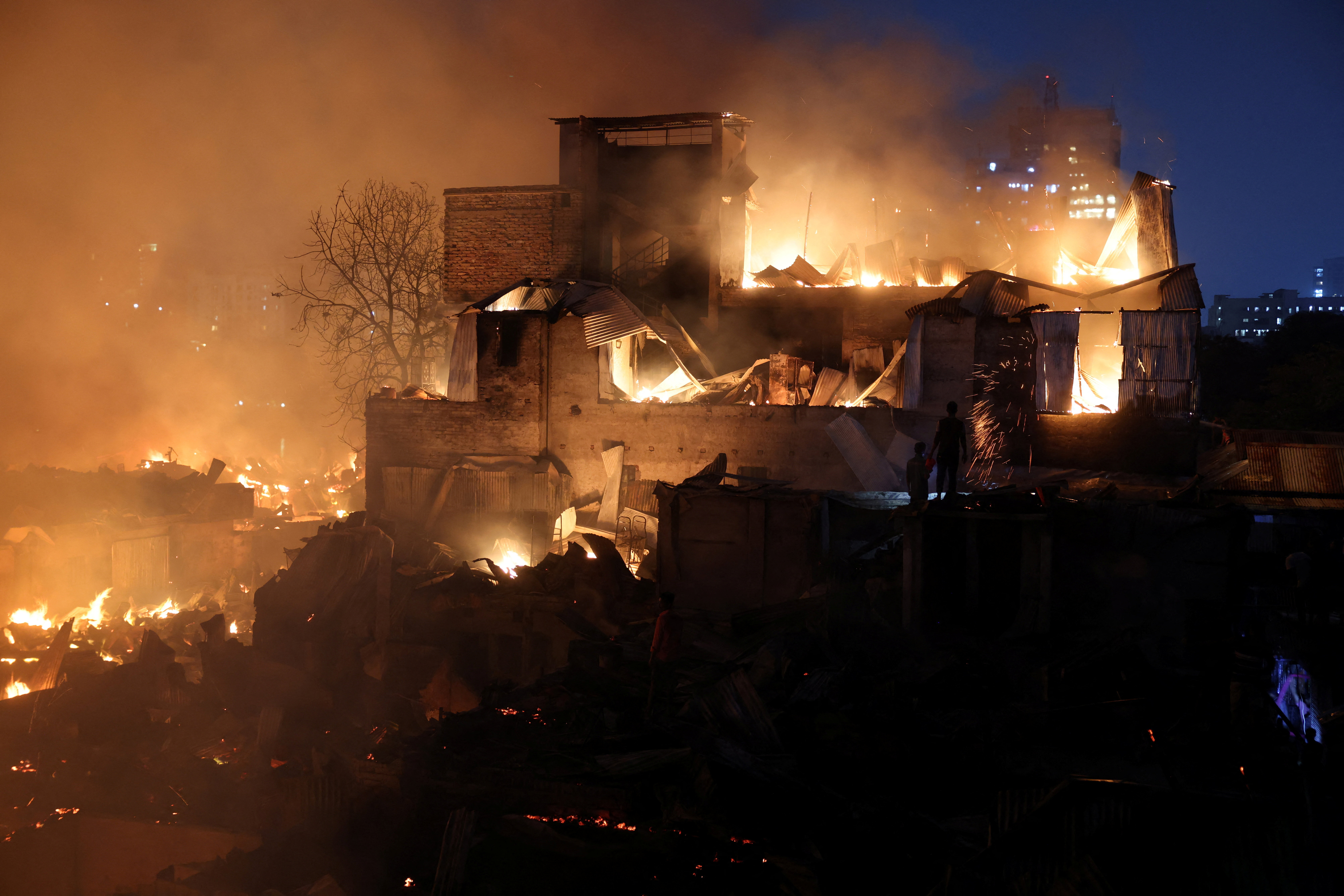 Flames engulf shanties after a fire broke out in Korail, Dhaka