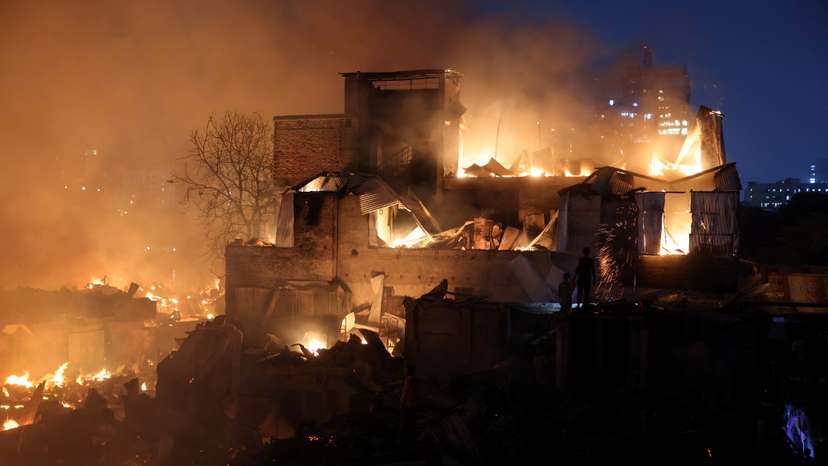 Flames engulf shanties after a fire broke out in Korail, Dhaka