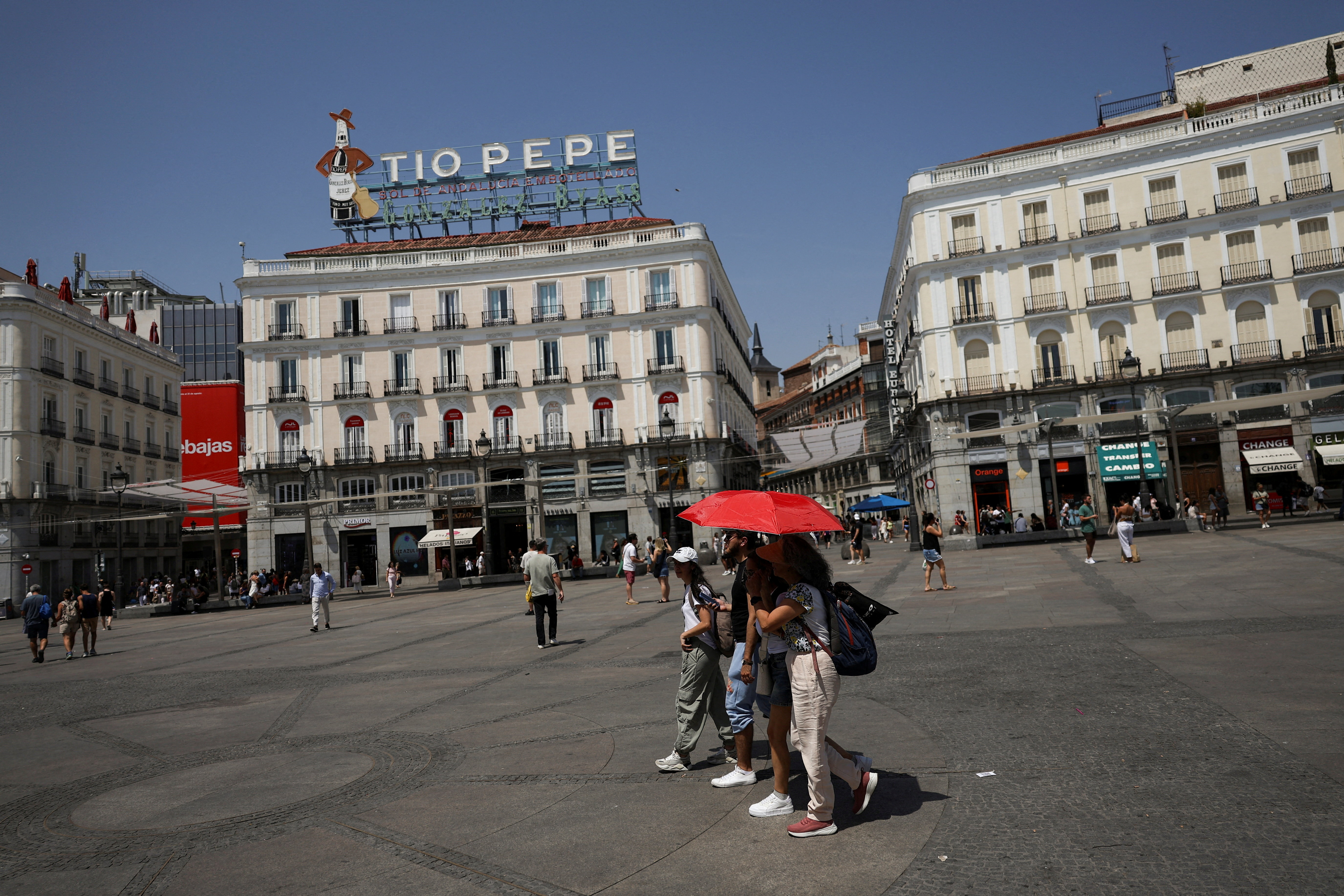 FILE PHOTO: People battle soaring temperatures during heatwave in Madrid