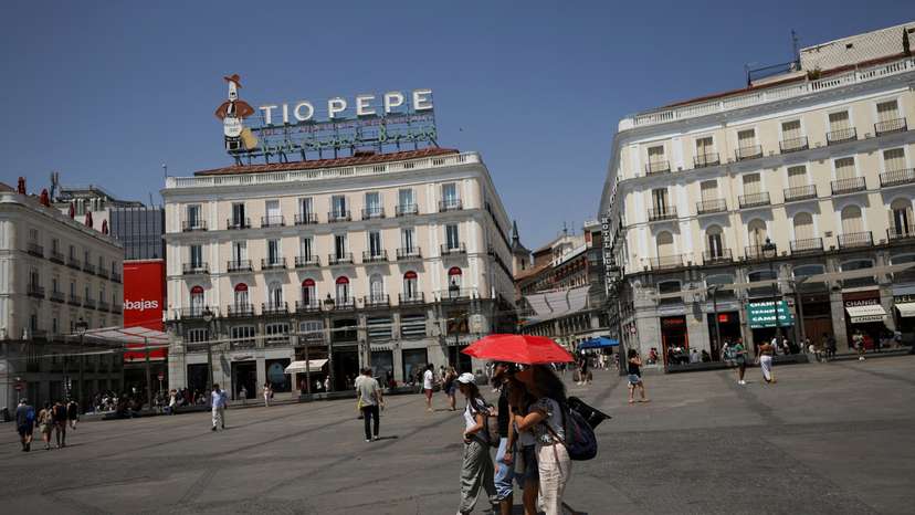 FILE PHOTO: People battle soaring temperatures during heatwave in Madrid
