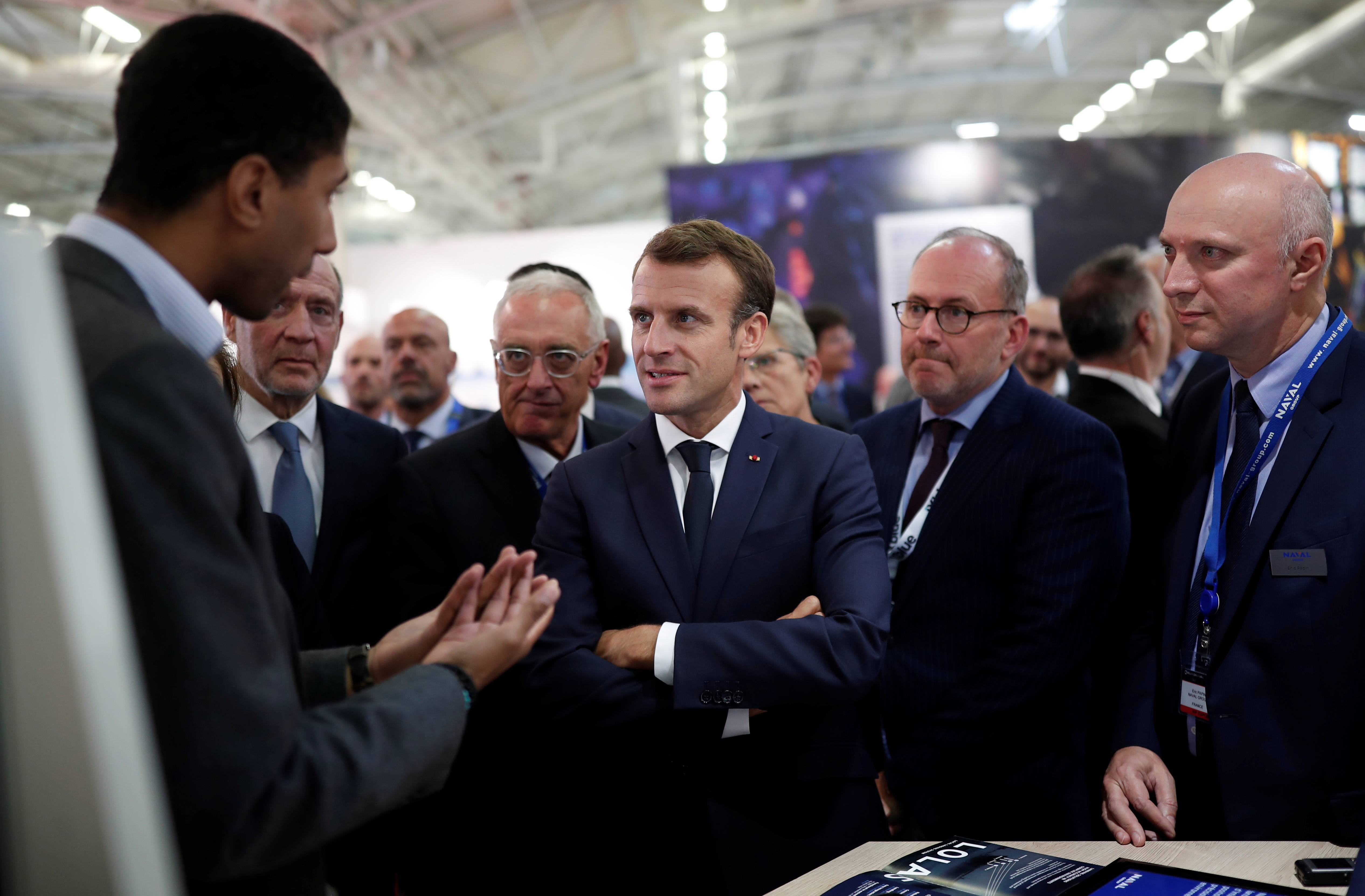 FILE PHOTO: French President Emmanuel Macron visits a stand at Euronaval, the world naval defence exhibition in Le Bourget near Paris