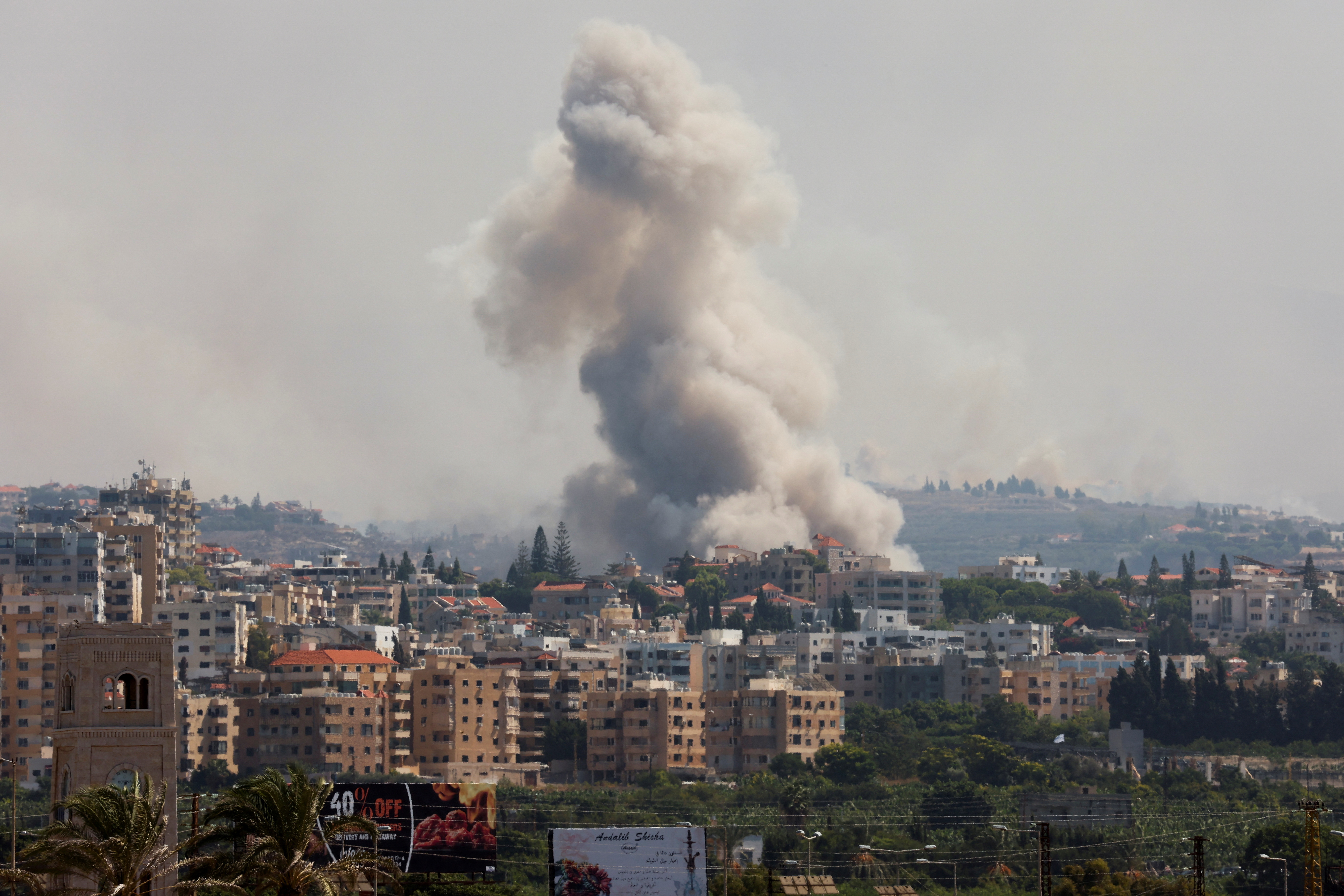 Smoke billows over southern Lebanon following Israeli strikes, as seen from Tyre, southern Lebanon