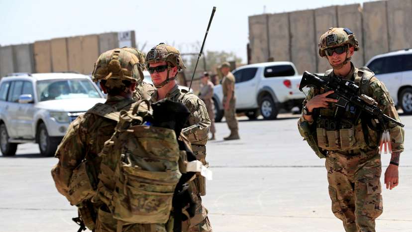 FILE PHOTO: U.S.-led troops withdraw from Iraq's Taji base